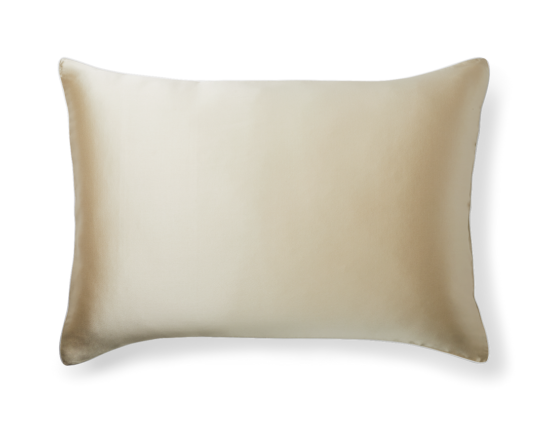 A KAILU silk pillowcase in champagne with white piping, made with the highest-quality, OEKO-TEX-certified mulberry silk in 25 momme silk weight