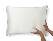 Hands hold a new KAILU silk pillowcase in white with black piping