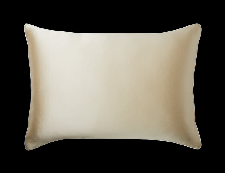 A KAILU silk pillowcase in champagne with white piping, made with the highest-quality, OEKO-TEX-certified mulberry silk in 25 momme silk weight