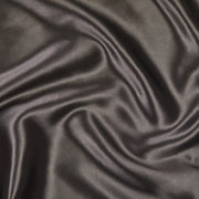 A close up of KAILU's luxurious silk pillowcase fabric in charcoal, made with the highest-quality, OEKO-TEX-certified mulberry silk in 22 momme silk weight